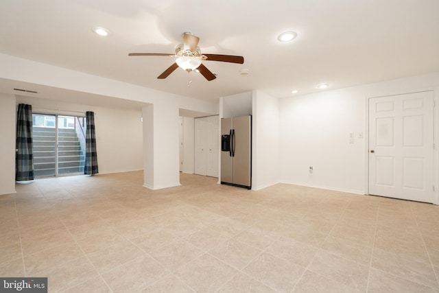 unfurnished living room with a ceiling fan, recessed lighting, and baseboards