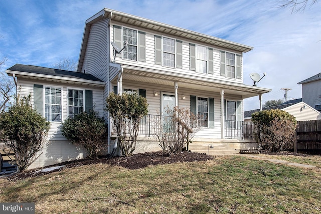 view of front of house with a porch and a front yard