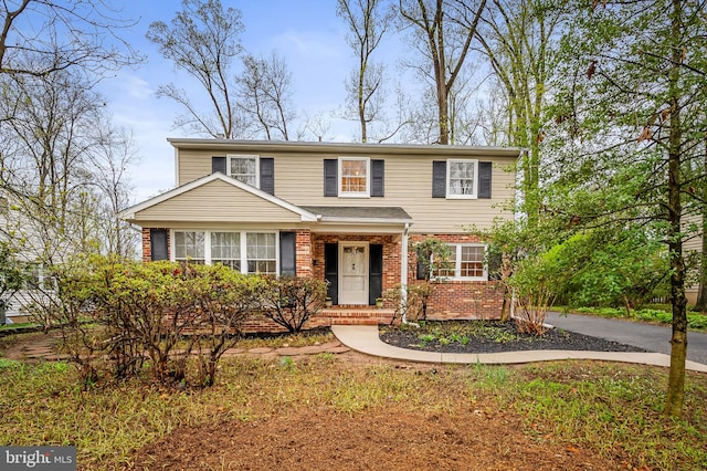 traditional home with brick siding
