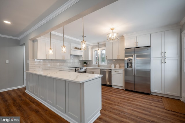 kitchen featuring light stone countertops, appliances with stainless steel finishes, white cabinets, and kitchen peninsula