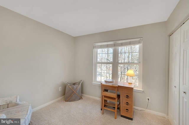 office area with light colored carpet and baseboards