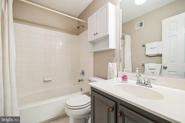 bathroom with visible vents, toilet, shower / bath combo with shower curtain, vanity, and tile patterned flooring