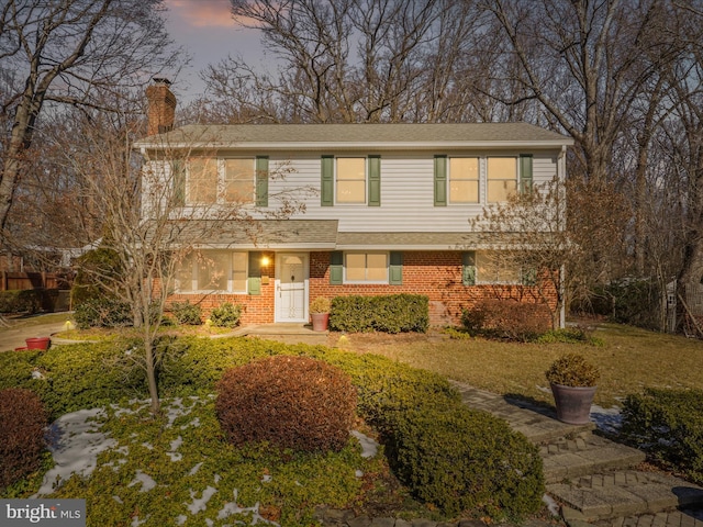 view of front of home with a lawn