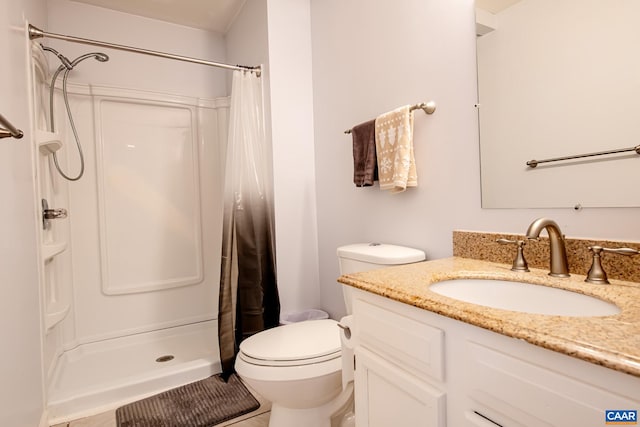 bathroom with vanity, toilet, and a shower with shower curtain