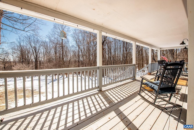 view of snow covered deck