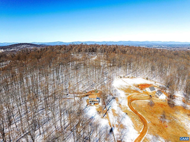 snowy aerial view with a mountain view