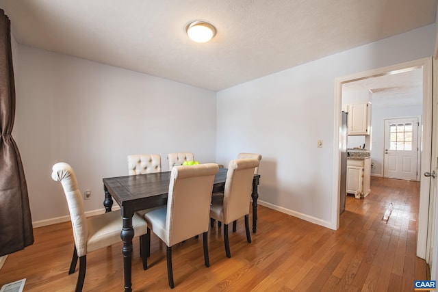 dining room with light hardwood / wood-style floors