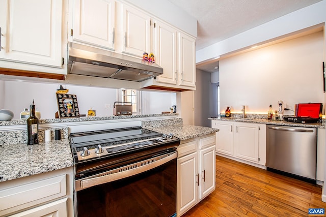 kitchen with white cabinetry, electric range oven, and dishwasher