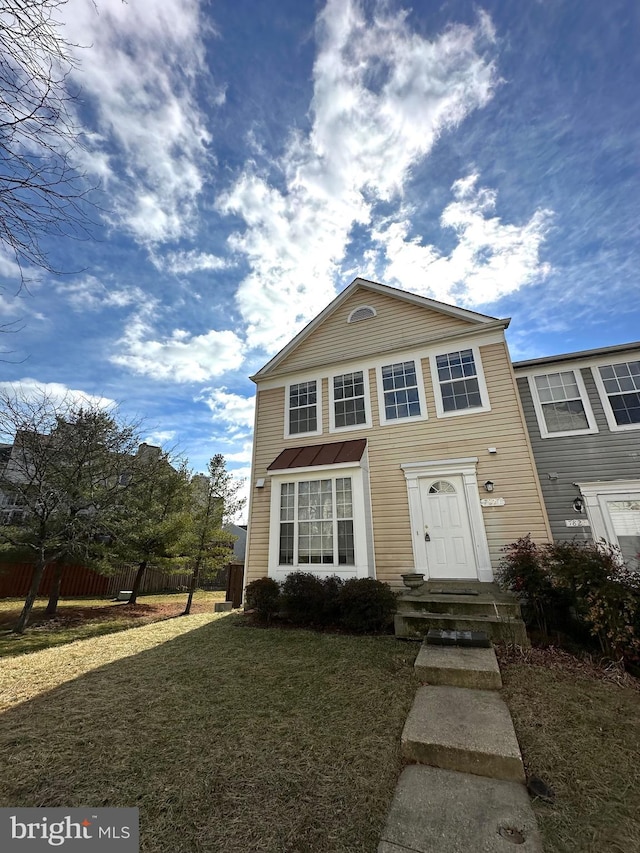 view of front of home with a front lawn