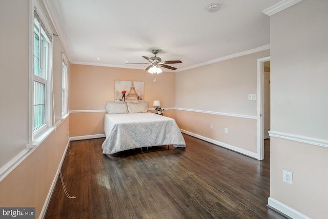 bedroom with ornamental molding, dark wood finished floors, and baseboards