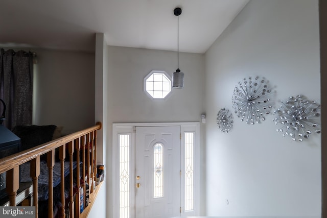 foyer entrance featuring a high ceiling