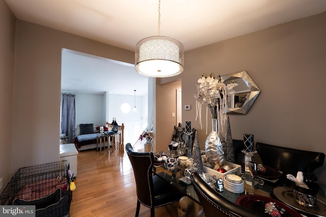 dining area featuring light wood-style flooring