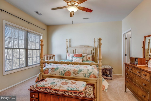 bedroom with light carpet, baseboards, and visible vents