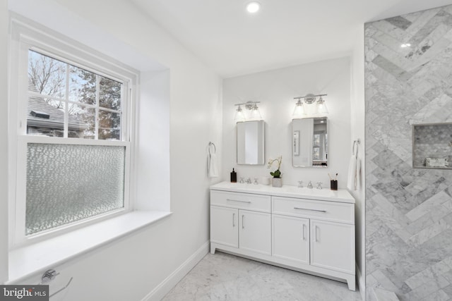 bathroom featuring vanity and a tile shower