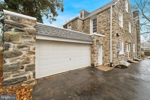 view of property exterior featuring a garage