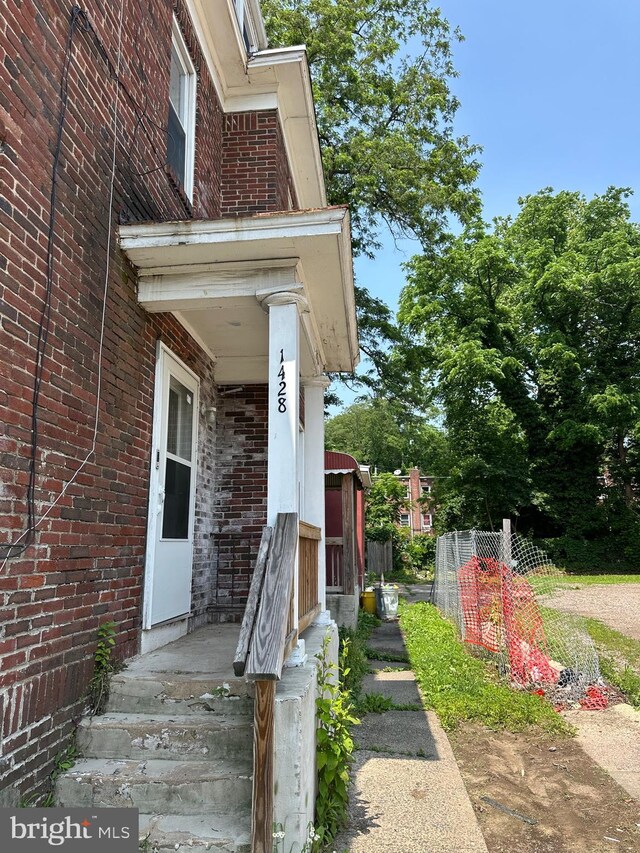 1428 W State St, Trenton, NJ 08618 - property entrance featuring brick siding