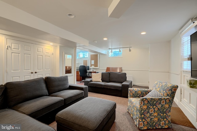 carpeted living room with recessed lighting