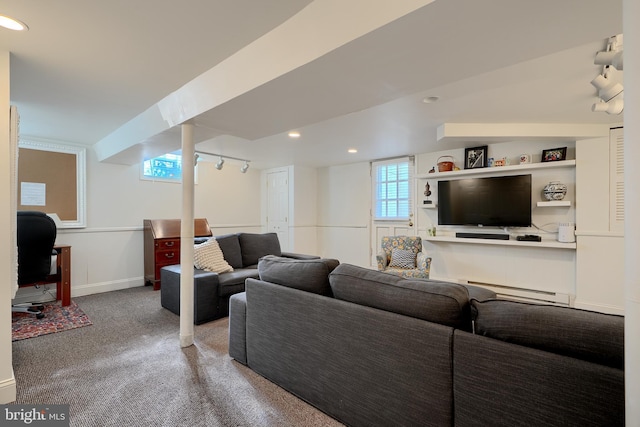 living area with recessed lighting, a baseboard heating unit, carpet floors, baseboards, and rail lighting