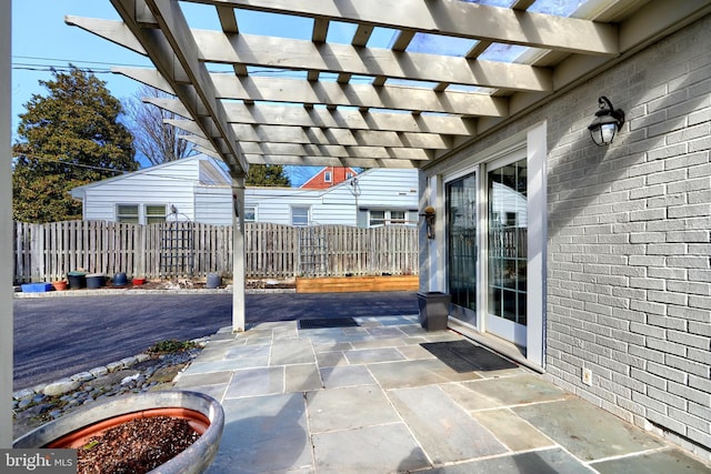 view of patio with fence and a pergola