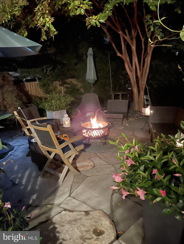 view of patio featuring an outdoor fire pit