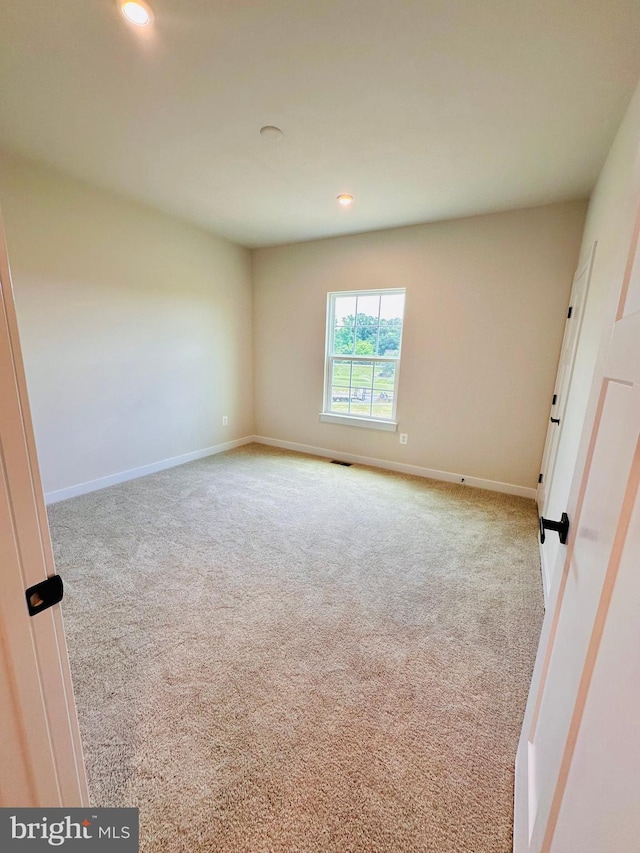 view of carpeted spare room