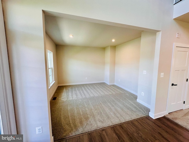 empty room with wood-type flooring