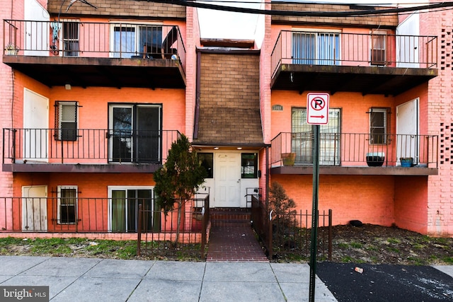 view of property with fence