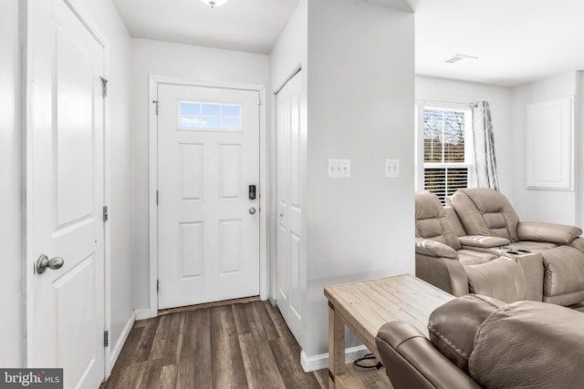 foyer entrance featuring dark hardwood / wood-style floors