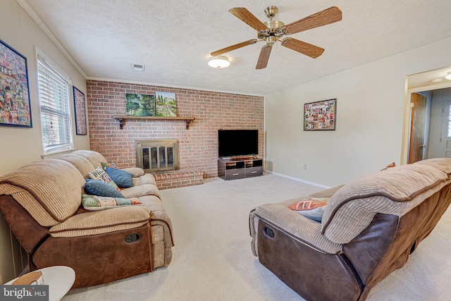 living area with light carpet, a textured ceiling, a fireplace, and visible vents