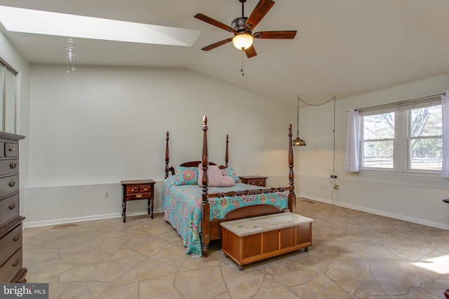 bedroom with ceiling fan and vaulted ceiling with skylight