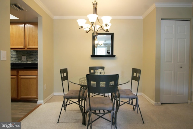 dining space featuring ornamental molding, visible vents, and baseboards