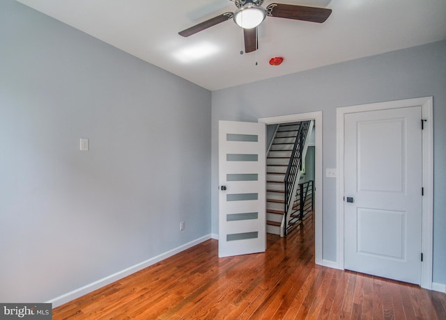 unfurnished bedroom featuring dark wood-type flooring