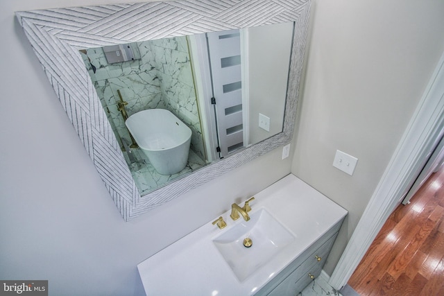 bathroom with vanity and wood-type flooring