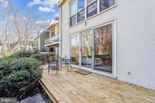 wooden terrace with outdoor dining area