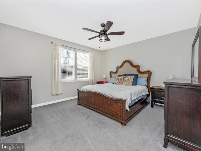 bedroom with light carpet and ceiling fan