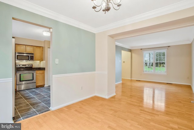 interior space featuring ornamental molding, dark hardwood / wood-style floors, and a notable chandelier