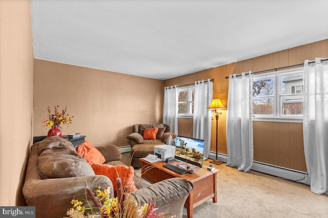 living room with light carpet and a baseboard heating unit