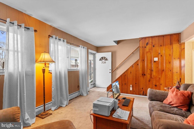 living room featuring light carpet and wooden walls