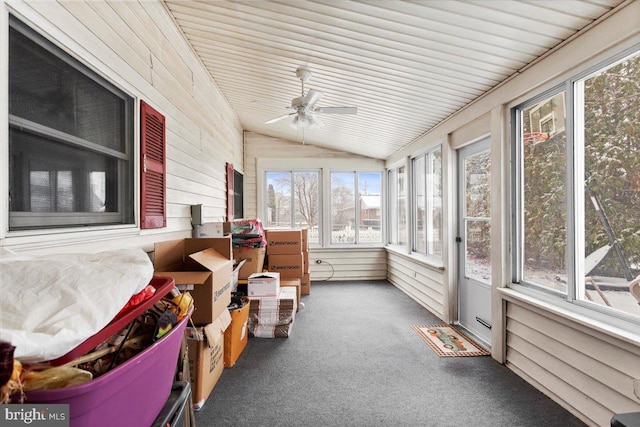 sunroom / solarium with ceiling fan and lofted ceiling