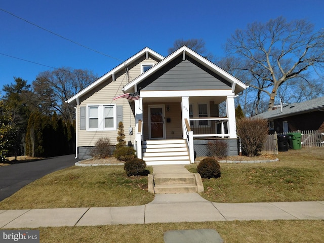 bungalow-style house featuring a front yard and a porch