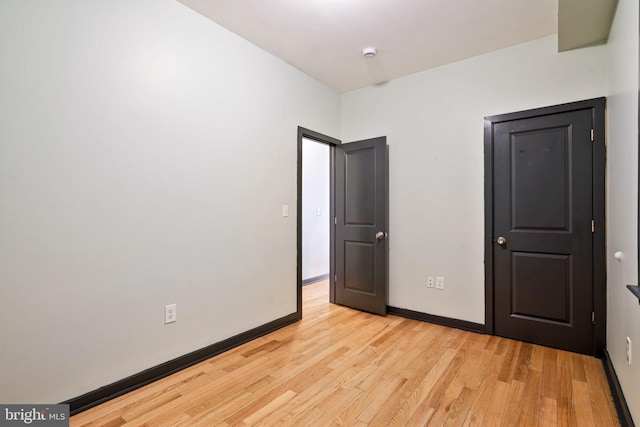 unfurnished bedroom with light hardwood / wood-style flooring