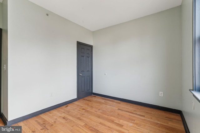 unfurnished room featuring light hardwood / wood-style floors