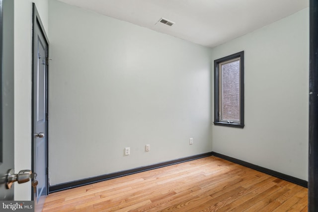 unfurnished room featuring light hardwood / wood-style floors