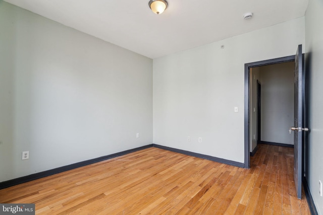 unfurnished room featuring hardwood / wood-style floors