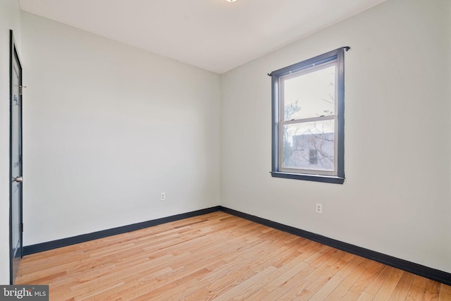 spare room with light wood-type flooring