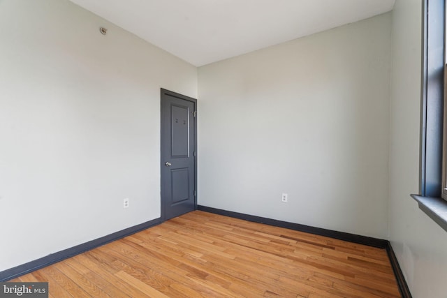 spare room featuring light wood-type flooring