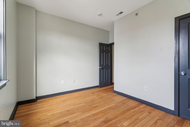 empty room featuring light hardwood / wood-style floors