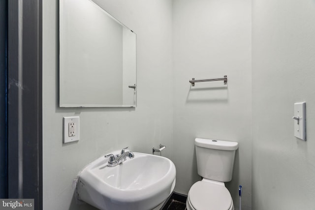 bathroom with sink and toilet