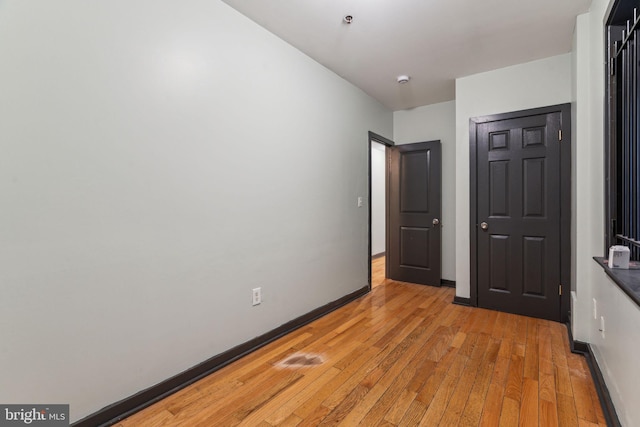 unfurnished bedroom with light hardwood / wood-style floors