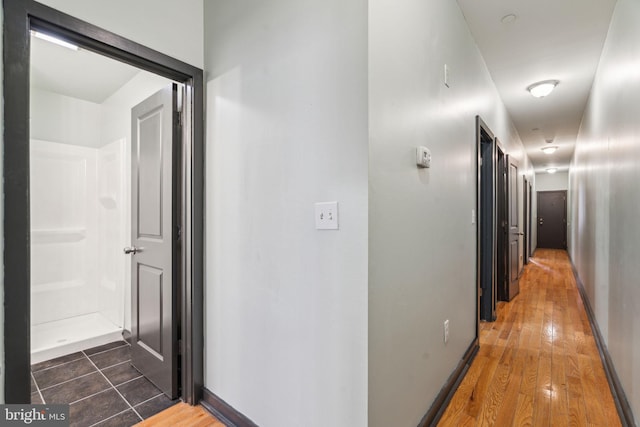 hall with dark hardwood / wood-style flooring